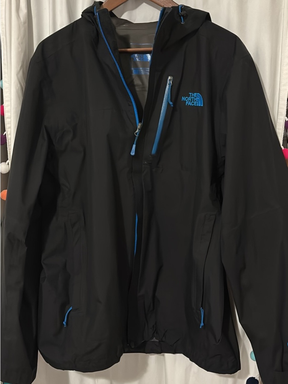 The North Face Black Raincoat with Blue Accents